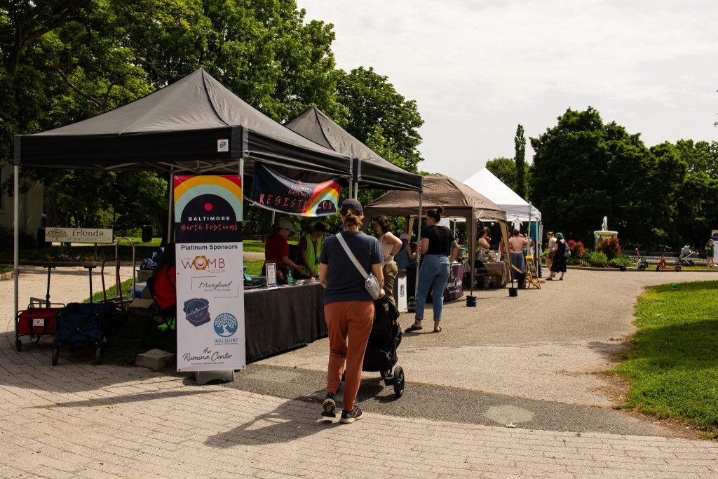 Families and vendors at the Baltimore Birth Festival in Patterson Park, Baltimore