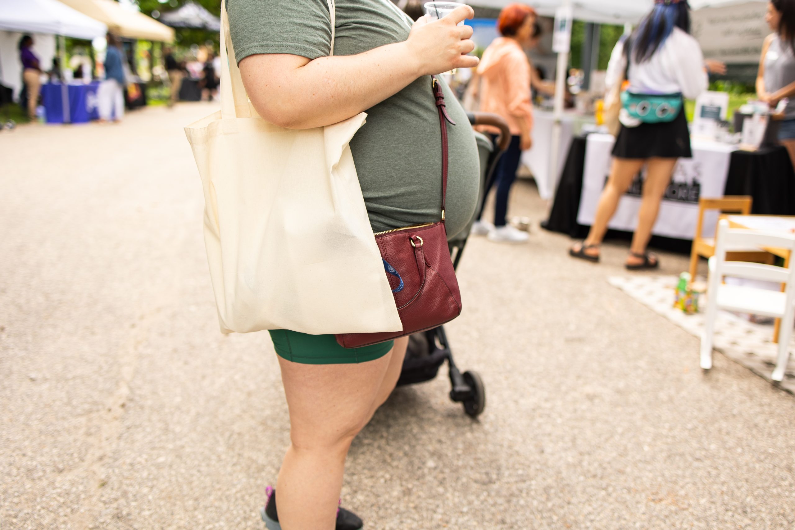 Pregnant mother visiting The Nanny Network booth at the Baltimore Birth Festival in Baltimore, Maryland