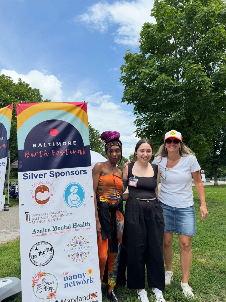 The Nanny Network team members Simira, Gris, and Dulany at the Baltimore Birth Festival in Baltimore, Maryland